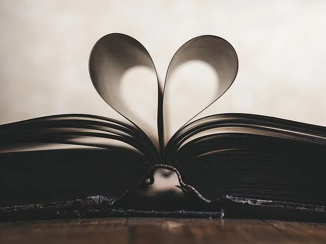 A crumpled ball of paper beside a blank sheet, evoking writer's block and self-doubt.