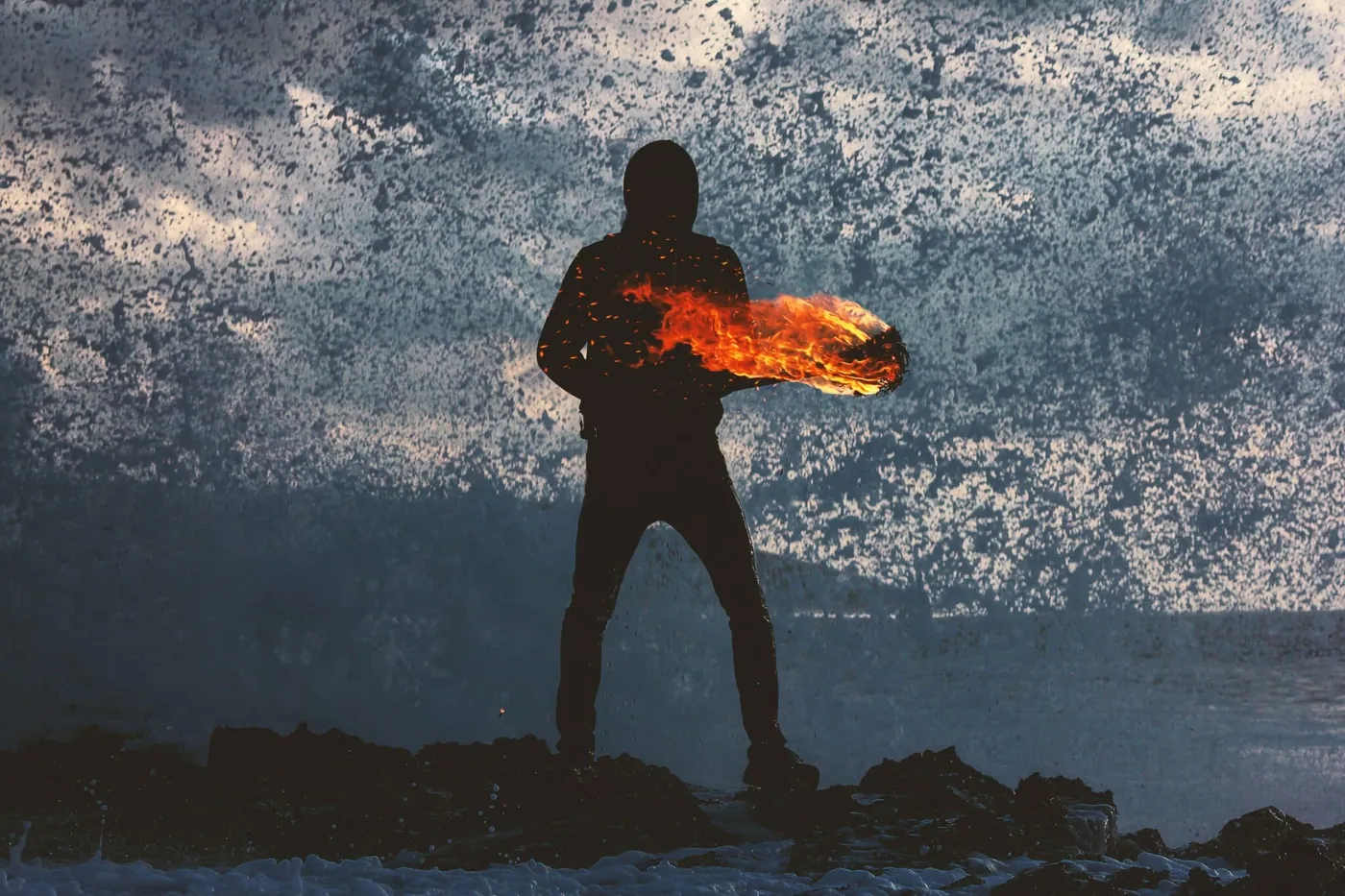 A silhouetted figure holding cupped flames against a stormy sky.
