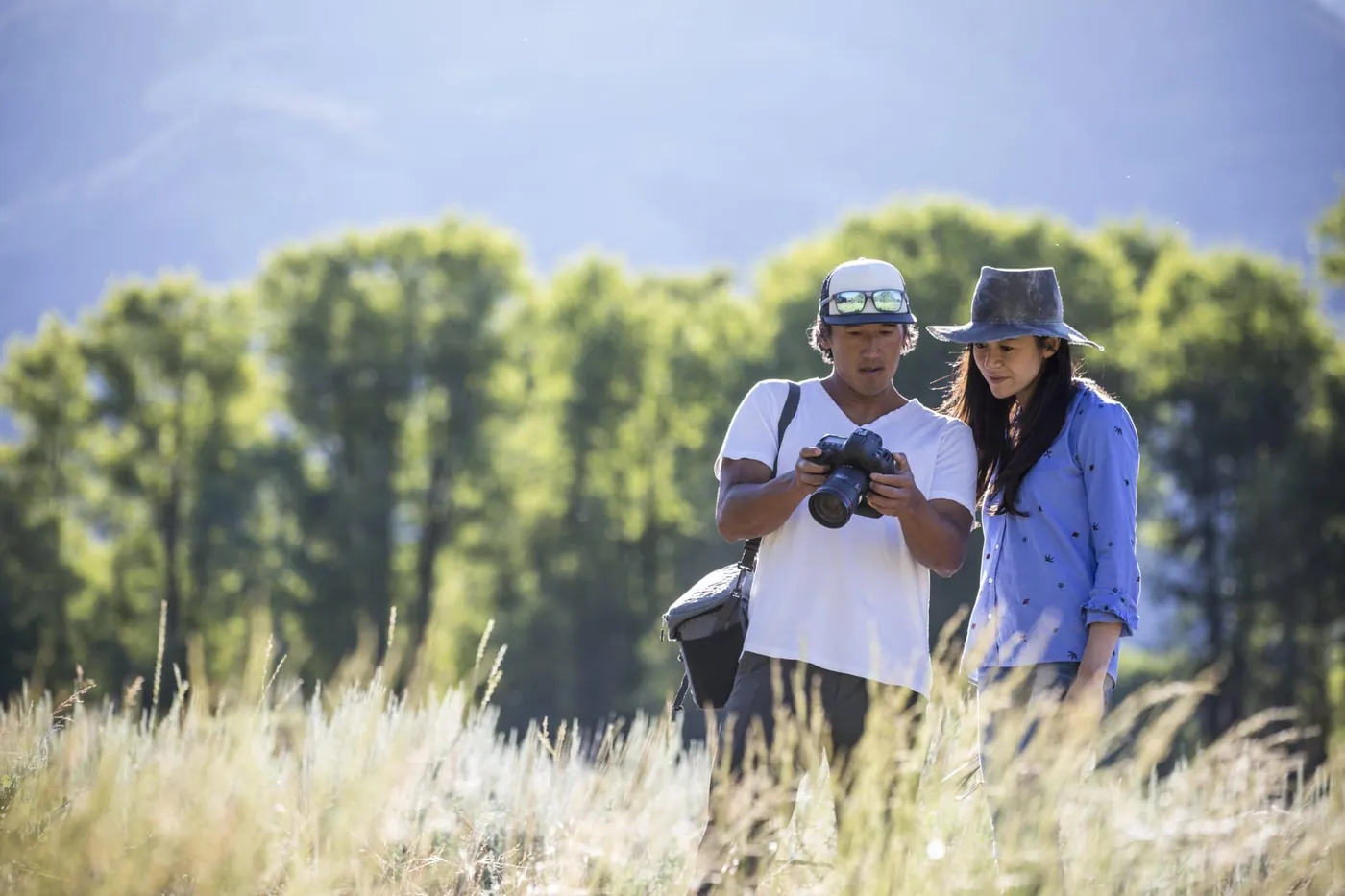 Jimmy Chin and Chai Vasarhelyi reviewing camera equipment outdoors during the filming of Free Solo. (National Geographic/Chris Figenshau)