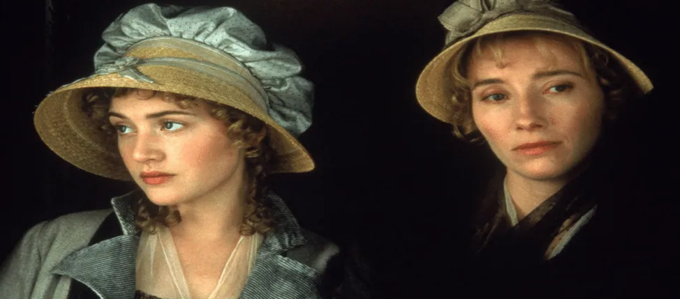 Film still from Sense and Sensibility: the Dashwood sisters, in bonnets, sit side by side with contrasting expressions.