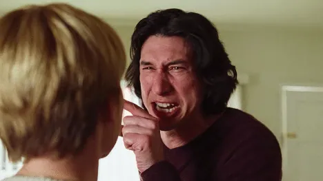 Film still from Marriage Story: Charlie, visibly distressed, gestures while arguing during a tense confrontation.