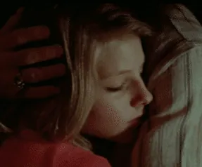Iris resting her head on Sport's shoulder during their slow dance, his hand cradling her hair.